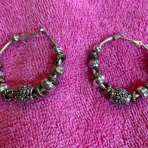 Women’s silver charmed hoop earrings